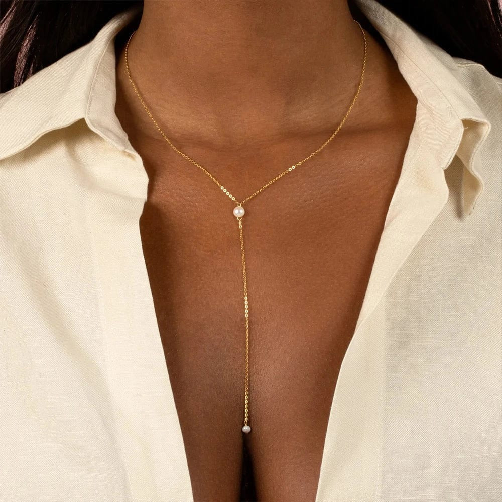 Chic and delicate gold-plated long chain necklace with pearl accents. Lightweight, durable, and perfect for adding a subtle shine to any outfit.