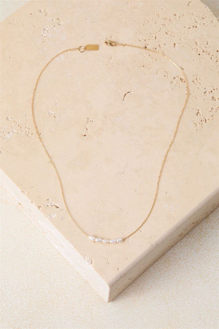 Elegant 16" freshwater pearl necklace on a 14k gold-filled or sterling silver cable chain. Delicate floating pearls add a refined touch to any look.