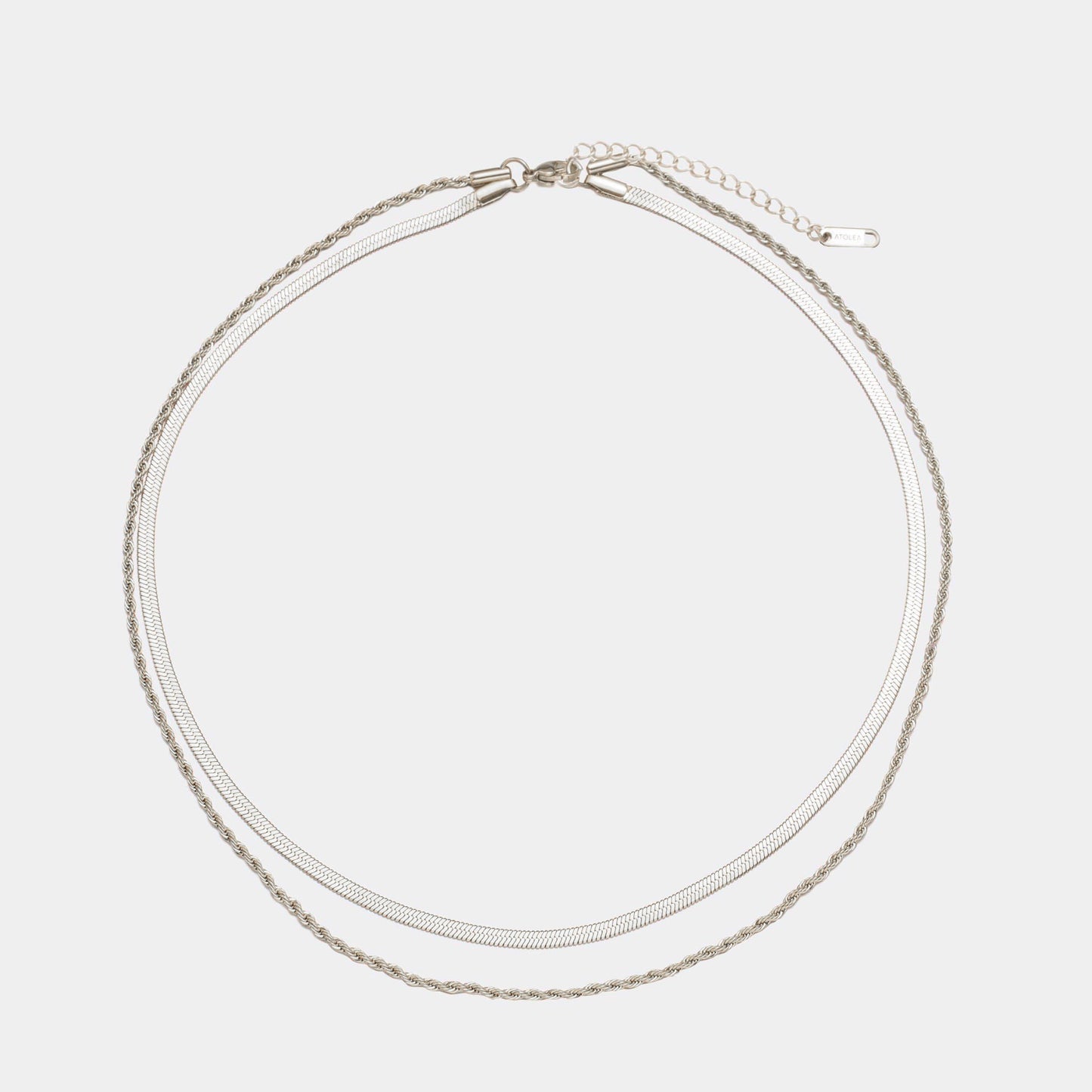 Elegant 18K gold-plated layered necklace with a herringbone choker and a delicate rope chain. Waterproof, sweatproof, and hypoallergenic for effortless elegance.